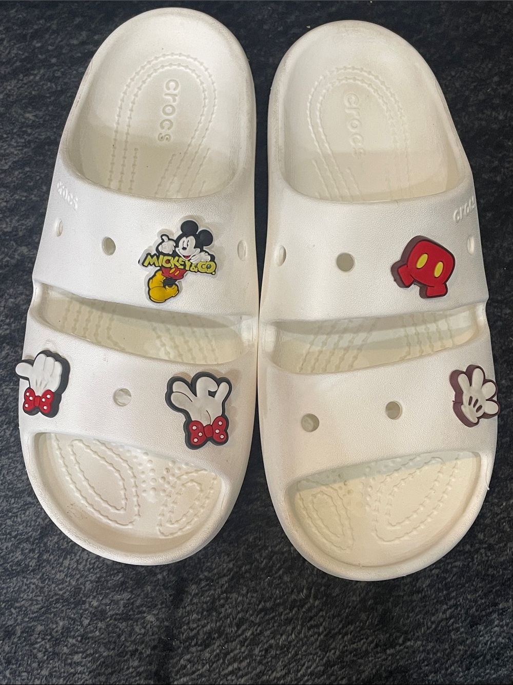 CROCS White Slide Sandals  Disney Character Jibbitz. Adult size 6-women’s. Used.